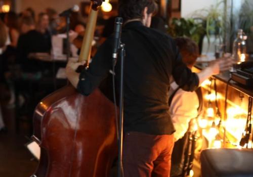 Musician playing the standup bass at Obladee